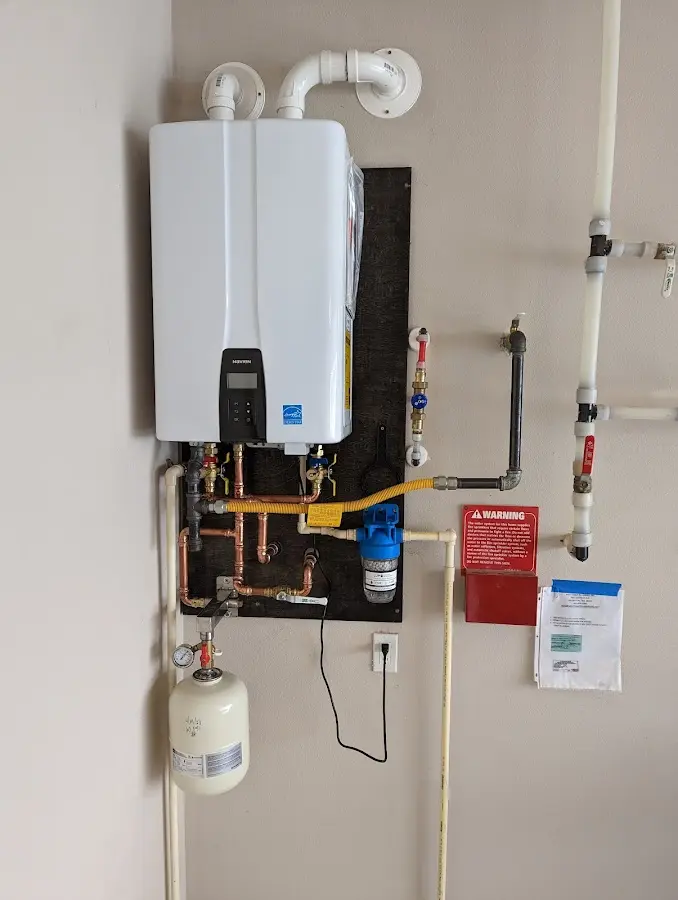 Professional plumber installing copper piping in a Port Orange home